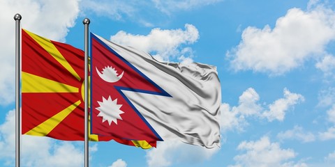 Macedonia and Nepal flag waving in the wind against white cloudy blue sky together. Diplomacy concept, international relations.