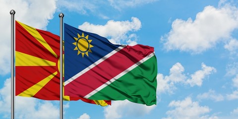Macedonia and Namibia flag waving in the wind against white cloudy blue sky together. Diplomacy concept, international relations.