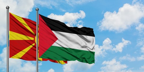 Macedonia and Palestine flag waving in the wind against white cloudy blue sky together. Diplomacy concept, international relations.