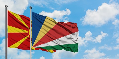 Macedonia and Seychelles flag waving in the wind against white cloudy blue sky together. Diplomacy concept, international relations.