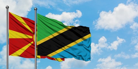 Macedonia and Tanzania flag waving in the wind against white cloudy blue sky together. Diplomacy concept, international relations.