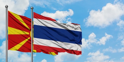 Macedonia and Thailand flag waving in the wind against white cloudy blue sky together. Diplomacy concept, international relations.