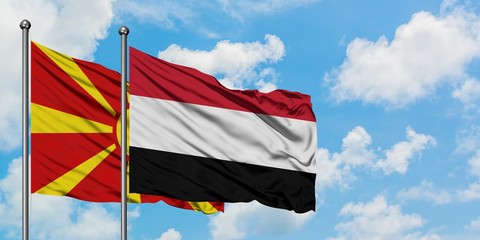 Macedonia and Yemen flag waving in the wind against white cloudy blue sky together. Diplomacy concept, international relations.