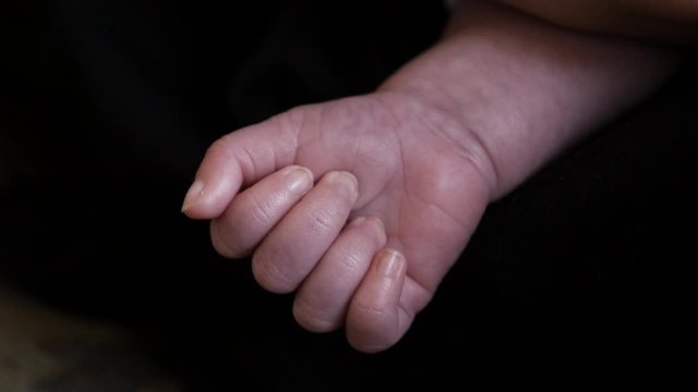 Close up of Newborn Baby Hand In Maternity 7