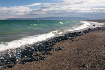 Cloudy sunset on a mountain lake. Mongolia