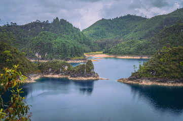 Beautiful landscape of a blue lake called Lagunas de Montebello in Chiapas, Mexico and in the background wooded mountains and a cloudy sky