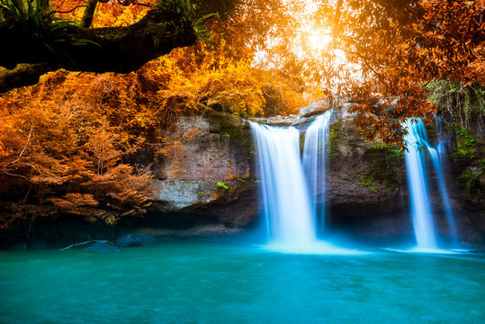 The amazing colorful waterfall in autumn forest blue water and colorful rain forest.