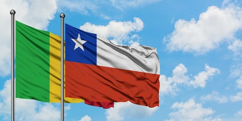 Mali and Chile flag waving in the wind against white cloudy blue sky together. Diplomacy concept, international relations.