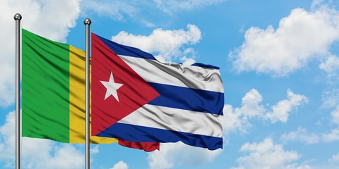 Mali and Cuba flag waving in the wind against white cloudy blue sky together. Diplomacy concept, international relations.