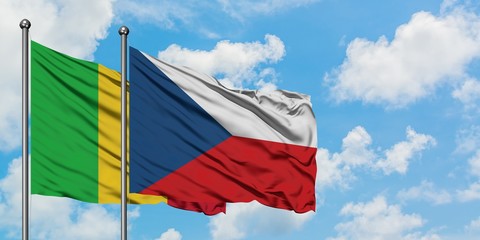 Mali and Czech Republic flag waving in the wind against white cloudy blue sky together. Diplomacy concept, international relations.