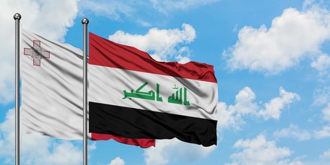 Malta and Iraq flag waving in the wind against white cloudy blue sky together. Diplomacy concept, international relations.
