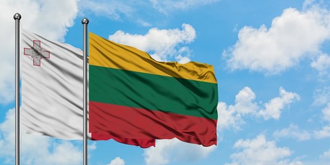 Malta and Lithuania flag waving in the wind against white cloudy blue sky together. Diplomacy concept, international relations.