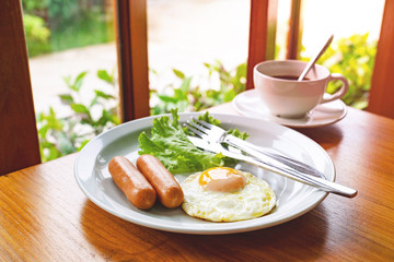 set breakfast with coffee,fried eggs, sausages