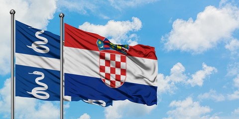 Martinique and Croatia flag waving in the wind against white cloudy blue sky together. Diplomacy concept, international relations.