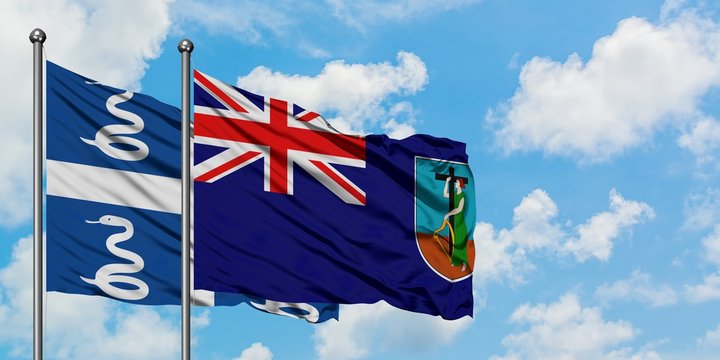 Martinique and Montserrat flag waving in the wind against white cloudy blue sky together. Diplomacy concept, international relations. - Powered by Adobe