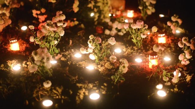 tomb decorated with flowers and candles on the occasion of the &rdquo;Day of the Dead&rdquo;