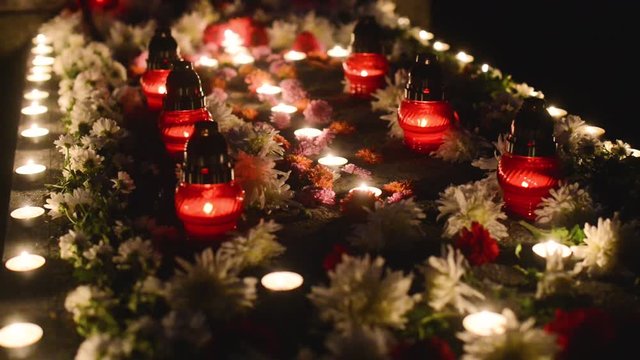 tomb decorated with flowers and candles on the occasion of the &rdquo;Day of the Dead&rdquo;