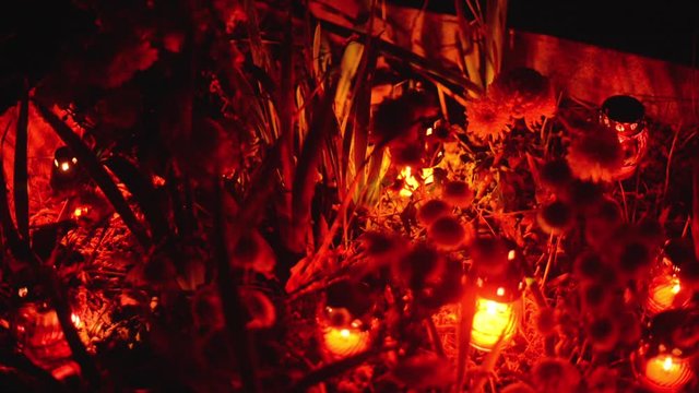 tomb decorated with flowers and candles on the occasion of the &rdquo;Day of the Dead&rdquo;