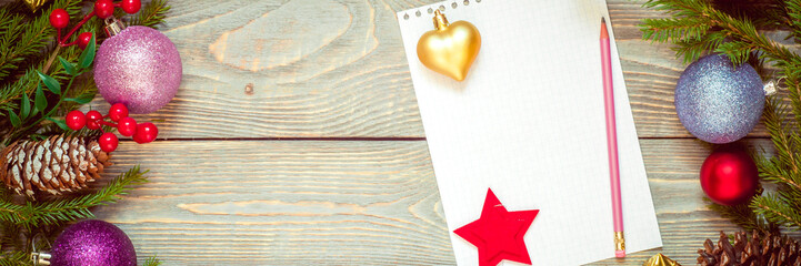 Christmas tree with decoration on a wooden board. Christmas toy. New year. Sheet for congratulations.
