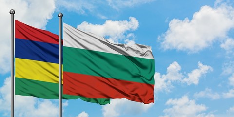 Mauritius and Bulgaria flag waving in the wind against white cloudy blue sky together. Diplomacy concept, international relations.