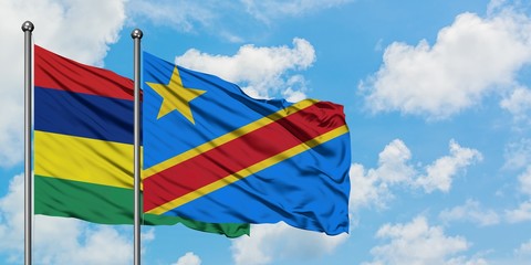 Mauritius and Congo flag waving in the wind against white cloudy blue sky together. Diplomacy concept, international relations.