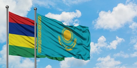 Mauritius and Kazakhstan flag waving in the wind against white cloudy blue sky together. Diplomacy concept, international relations.