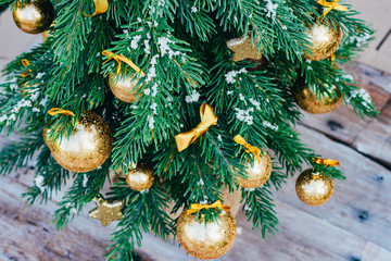 Christmas background. Green fir tree with golden balls and gift boxes. - 301052512