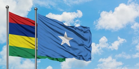 Mauritius and Somalia flag waving in the wind against white cloudy blue sky together. Diplomacy concept, international relations.