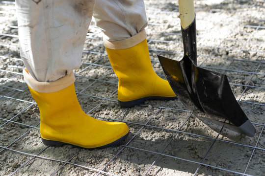 Worker with yellow boots