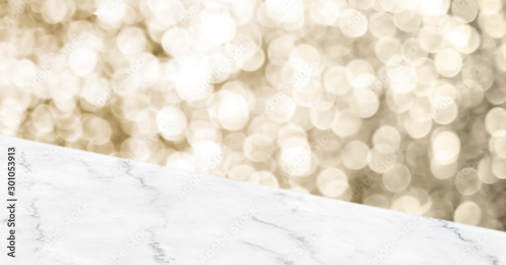 Poster Empty white marbker angle table top with blur sparkling gold bokeh abstract background,panoramic banner for display or montage of product,Holiday seasonal concept backdrop.