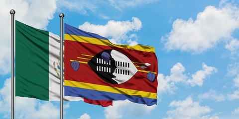 Mexico and Swaziland flag waving in the wind against white cloudy blue sky together. Diplomacy concept, international relations.