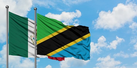 Mexico and Tanzania flag waving in the wind against white cloudy blue sky together. Diplomacy concept, international relations.