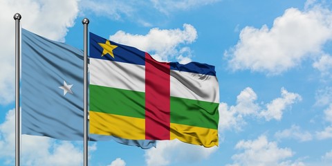 Micronesia and Central African Republic flag waving in the wind against white cloudy blue sky together. Diplomacy concept, international relations.