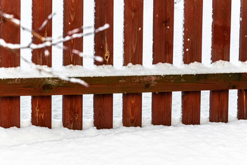 Fototapeta premium Fresh fluffy snow in the backyard of a rural house.