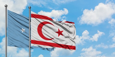Micronesia and Northern Cyprus flag waving in the wind against white cloudy blue sky together. Diplomacy concept, international relations.