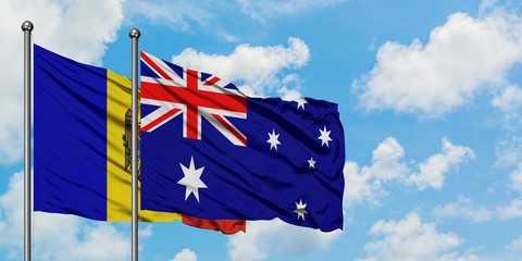 Moldova and Australia flag waving in the wind against white cloudy blue sky together. Diplomacy concept, international relations.