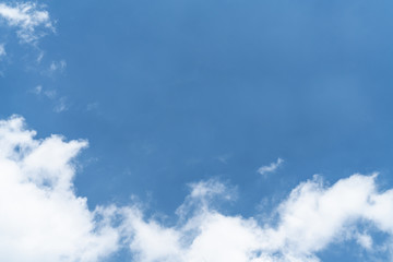 White cloud and blue sky background with copy space