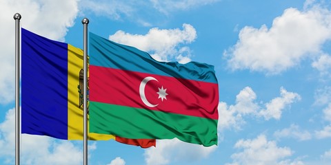 Moldova and Azerbaijan flag waving in the wind against white cloudy blue sky together. Diplomacy concept, international relations.
