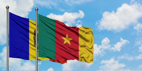 Moldova and Cameroon flag waving in the wind against white cloudy blue sky together. Diplomacy concept, international relations.