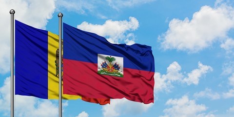 Moldova and Haiti flag waving in the wind against white cloudy blue sky together. Diplomacy concept, international relations.