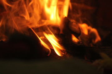 uncontrollable Fire and oil lamp fire flames on one single picture with orange / red / black and white color fire flame with black background.