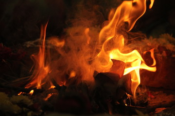 uncontrollable Fire and oil lamp fire flames on one single picture with orange / red / black and white color fire flame with black background.