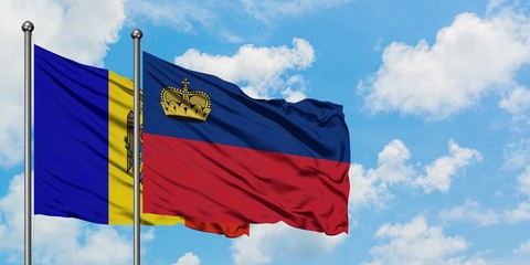 Moldova and Liechtenstein flag waving in the wind against white cloudy blue sky together. Diplomacy concept, international relations.