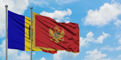 Moldova and Montenegro flag waving in the wind against white cloudy blue sky together. Diplomacy concept, international relations.