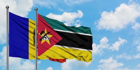 Moldova and Mozambique flag waving in the wind against white cloudy blue sky together. Diplomacy concept, international relations.