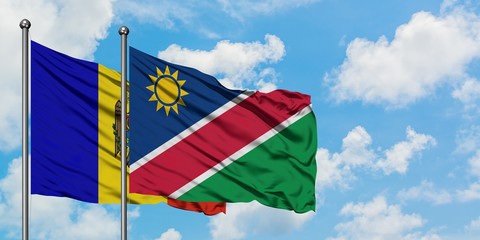 Moldova and Namibia flag waving in the wind against white cloudy blue sky together. Diplomacy concept, international relations.