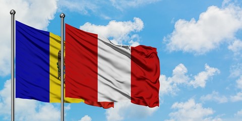 Moldova and Peru flag waving in the wind against white cloudy blue sky together. Diplomacy concept, international relations.