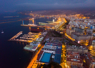 Aerial view of old town Almeria port and buildings at evening