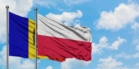 Moldova and Poland flag waving in the wind against white cloudy blue sky together. Diplomacy concept, international relations.