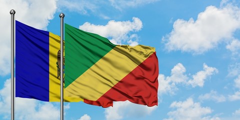 Moldova and Republic Of The Congo flag waving in the wind against white cloudy blue sky together. Diplomacy concept, international relations.